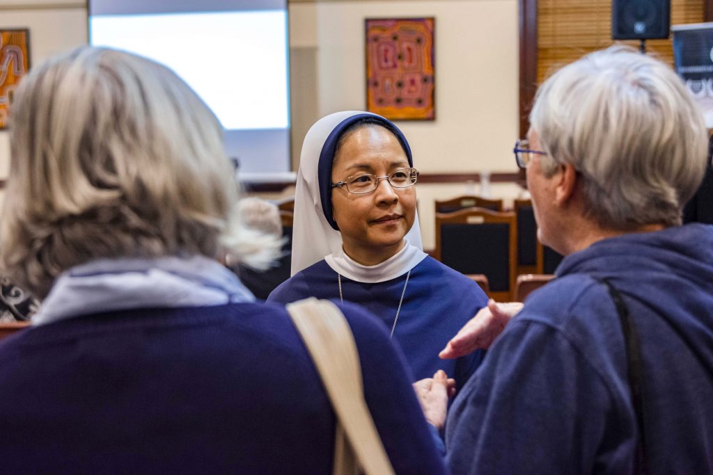 Sister Antoniana Maria SV of the Sisters of Life talks with two attendees of “Walking with Love” at UNDA. Photo: Eric Martin.