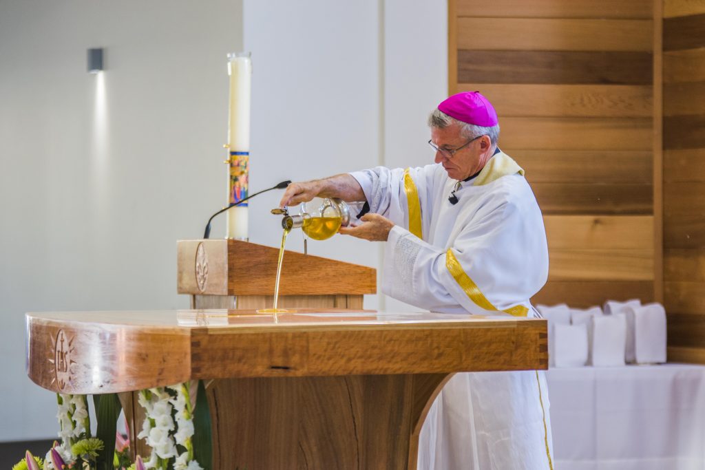 Archbishop Timothy Costelloe SDB anoints the altar with Chrism oil at the new St Joseph Pignatelli Church on Sunday 13 May 2018. Photo: Matthew Lau.