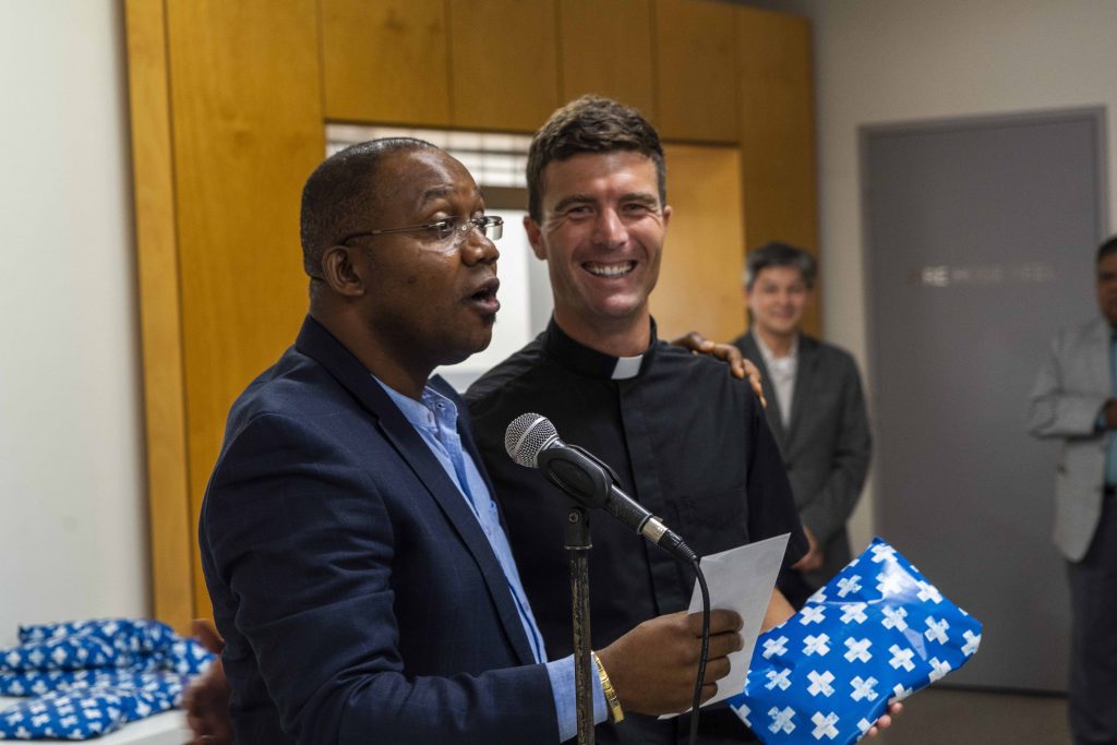 Fr Bonaventure Echeta congratulates Deacon Liam Ryan. Photo: Josh Low.