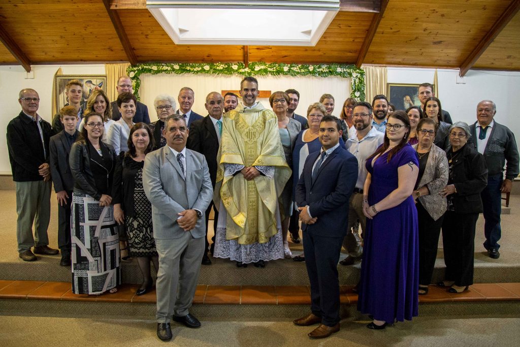 Fr Chris de Sousa joined by family following his ordination to the priesthood. Photo: Jamie O'Brien.