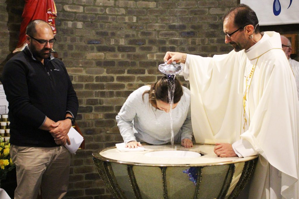 Kolbe Catholic College staff member Kelly Toma was one of the catechumens of OLOL Church to be baptised this year. Photo: Supplied.