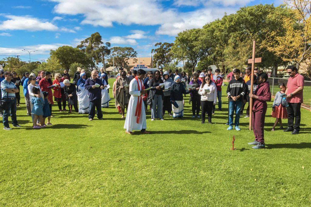 Kalgoorlie-Boulder parishioners began the Stations of the Cross at the St Mary’s School oval, and then proceeded into the Church for the final station. Photo: Robert Hicks.