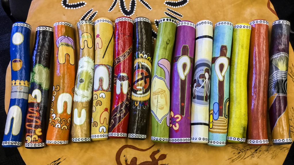 Prendiville Catholic College’s Message Sticks: an example of Aboriginal and Christian art combining to tell the story of the Stations of the Cross. Photo: Supplied.